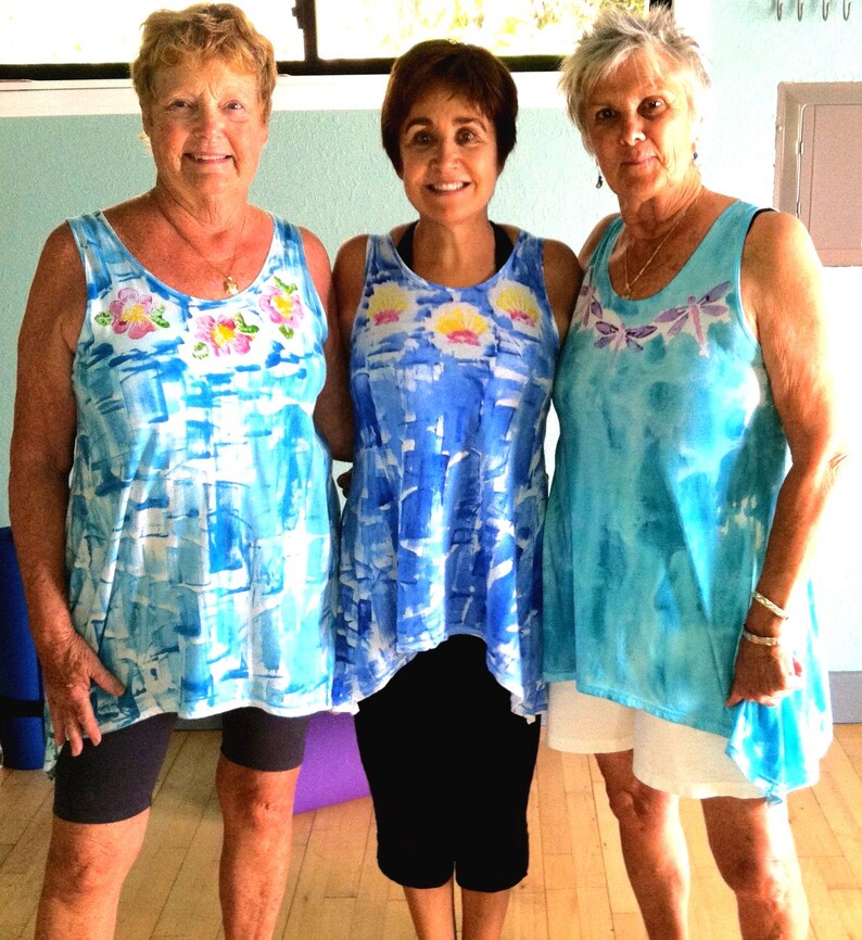 hibiscus lei, sunrise shell lei and dragonfly lei on cotton elliptical hem tunic