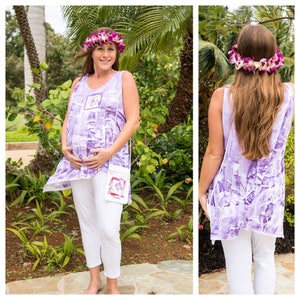 May include: A pregnant person wearing a purple and white sleeveless top with a floral headband and a white crossbody bag. The person is standing in front of a lush green background.