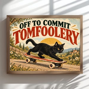 May include: A framed rectangular wall art print featuring a black cat riding a red and white skateboard on a dirt path. The text "OFF TO COMMIT TOMFOOLERY" is printed in large black and red letters above the cat, with a yellow sun in the background.