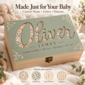 May include: A rectangular wooden keepsake box with a sage green lid featuring the name Oliver in large cut-out letters revealing a floral pattern. Below, the text reads JAMES, October 8, 2026, 7 lbs 4 oz, 20 inches, and 6:42 am.