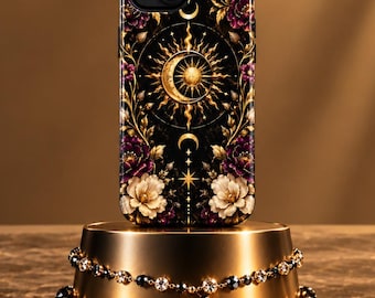 May include: A black smartphone case featuring a central gold sun and crescent moon emblem surrounded by intricate gold filigree, starbursts, and clusters of white and deep purple flowers against a dark background with a dual-camera cutout.