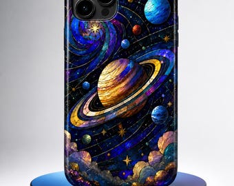May include: A smartphone case featuring a vibrant stained glass style design of a ringed planet, smaller celestial bodies, and swirling nebulae in shades of deep blue, purple, and gold, with a triple camera lens cutout at the top left corner.