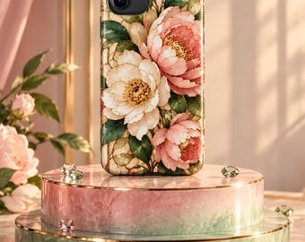 May include: A rectangular smartphone case featuring a detailed floral print of large pink and white peonies with green leaves. The design includes gold-toned line accents throughout the petals and foliage, set against a light background.