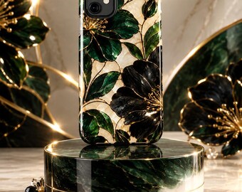 May include: A smartphone case featuring a dark green and black floral pattern with gold-toned outlines against a cream-colored background. The case has a dual-lens camera cutout and is displayed on a cylindrical green and white marble stand.