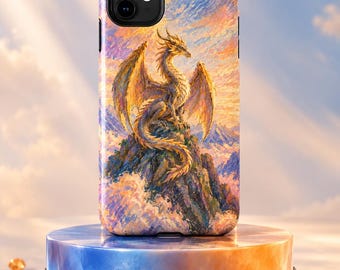 May include: A rectangular smartphone case featuring a vibrant, painterly illustration of a golden dragon perched atop a craggy mountain peak against a sunset sky with clouds. The design uses warm orange, yellow, and cool blue tones throughout.