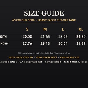 May include: A black size guide chart for the AS Colour 5084 heavy faded cut-off tank. The chart lists width and length measurements in inches for sizes S, M, L, and XL. It specifies a boxy oversized fit, wide shoulders, raw armholes, 100% carded cotton.