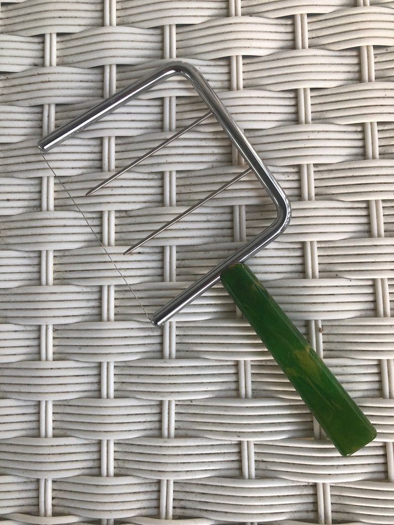 Made by C.JSchnider Mfg About 7-14 in long Nice Beautiful vintage green bakelite handled cheese slicer from approx 1940s