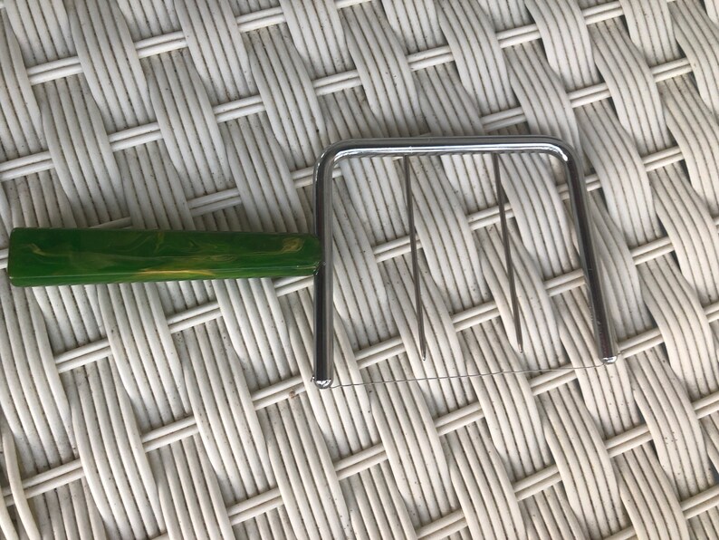 Made by C.JSchnider Mfg About 7-14 in long Nice Beautiful vintage green bakelite handled cheese slicer from approx 1940s