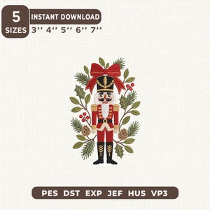 May include: An embroidery design featuring a nutcracker in a red and gold uniform, topped with a red bow, surrounded by a wreath of pine branches, holly leaves, red berries, and pinecones. Text includes 5 SIZES 3'' 4'' 5'' 6'' 7'' and PES DST EXP JEF HUS VP3.