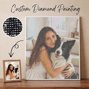 May include: A custom diamond painting kit featuring a pixelated image of a person hugging a black and white dog. The set includes a circular inset showing black faceted resin drills and a small framed example of the finished artwork.