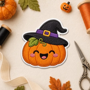 May include: An embroidered patch featuring a smiling orange pumpkin wearing a black witch hat with a purple band and yellow buckle. The pumpkin has a green leaf, closed eyes, and pink cheeks, outlined in white thread on a textured fabric background.
