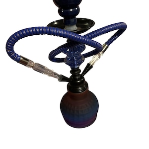 May include: A hookah featuring a frosted glass base with a blue and purple gradient, a black metal stem, and a blue flexible hose with a clear acrylic mouthpiece. The structure includes a black tray and a blue glass decorative section on the stem.