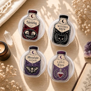 May include: Four clear circular containers topped with rectangular labels featuring potion bottle illustrations. Labels include text reading The Spooky Drink Okult, Witches Brew, Moonlight Potion, and Love Elixir, decorated with skulls, a cat, a moth, and a heart.