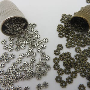 Restocked ! 100 per qty !   Beaders must Have ! 4mm DAISY Spacer !  Antique Silver -or- Antique Bronze ( 100 pc  )