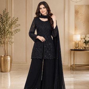 May include: A black three-piece ensemble consisting of a long-sleeved tunic with intricate tonal embroidery and sequins, wide-leg trousers with a matching embroidered hem, and a sheer black dupatta with a delicate sequined border detail.