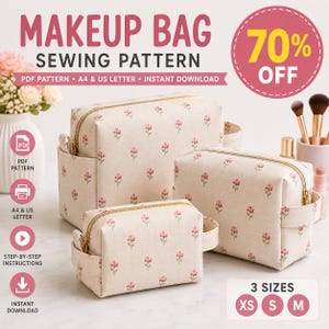May include: Three rectangular makeup bags in varying sizes, crafted from a cream-colored fabric featuring a repeating pattern of small pink flowers with green stems. Each bag includes a gold-tone zipper closure and a side handle for carrying.