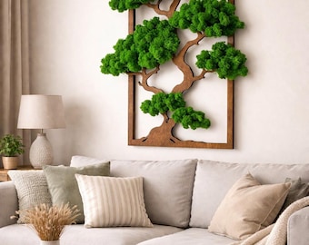 May include: A rectangular wall art piece featuring a dark brown wooden frame containing a cutout of a tree silhouette. The tree branches are filled with vibrant green preserved moss, creating a textured, three-dimensional botanical display.