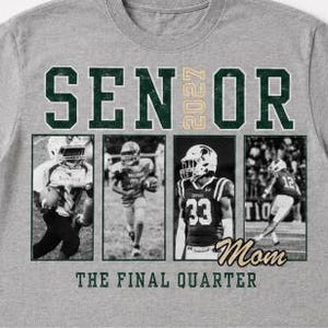 May include: A heather grey t-shirt featuring the text SENIOR 2027 in dark green and gold. Below, four black and white photographic panels show football players in action. The word Mom is written in gold script, and THE FINAL QUARTER is in green.
