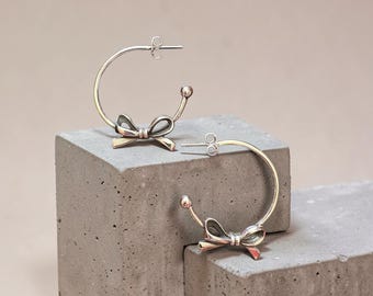 Bow Accented Hoop Earrings in Sterling Silver