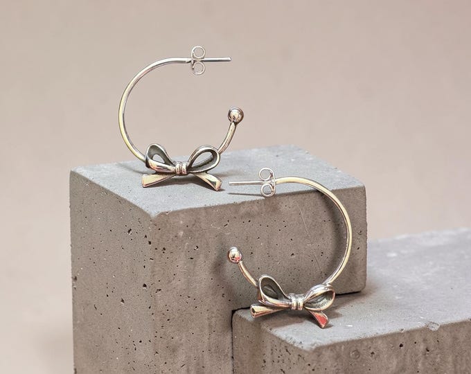 Bow Accented Hoop Earrings in Sterling Silver
