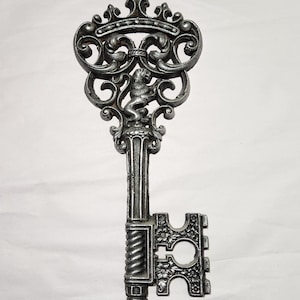 old-timey looking giant key wall decoration from the 70s