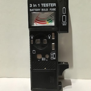 90s vintage battery, light bulb and fuse tester