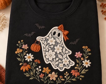 May include: A black crewneck sweatshirt featuring an embroidered design of a white lace ghost holding a small orange pumpkin. The ghost wears a brown bow and is surrounded by embroidered colorful flowers, green leaves, and three small black bats.