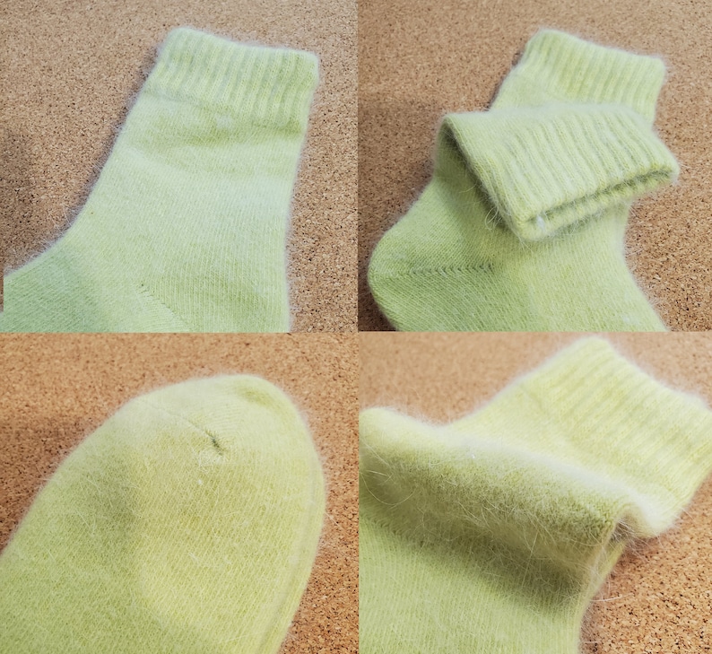 May include: A pair of light lime green socks featuring a soft, fuzzy texture. The socks have a ribbed cuff at the top and a rounded toe section. The material appears to have a fine, brushed finish with visible fibers throughout the fabric.