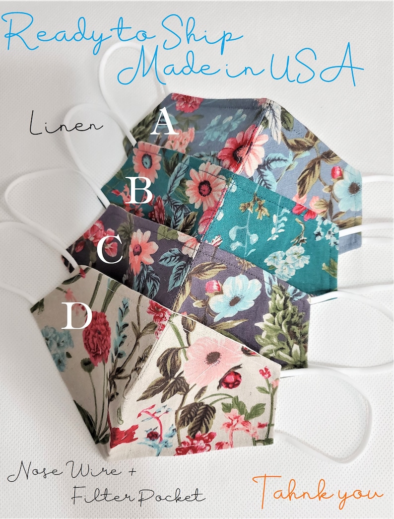 May include: Four fabric face masks with floral patterns. The masks are layered in a stack, with the top mask being a light blue with pink flowers, the second mask is a teal green with pink flowers, the third mask is a dark gray with pink and blue flowers, and the bottom mask is a beige with pink and red flowers. The masks have nose wires and filter pockets. The text "Ready to Ship Made in USA" is at the top of the image. The text "Linen" is at the left side of the image. The text "Nose Wire + Filter Pocket" is at the bottom left of the image. The text "Thank you" is at the bottom right of the image.