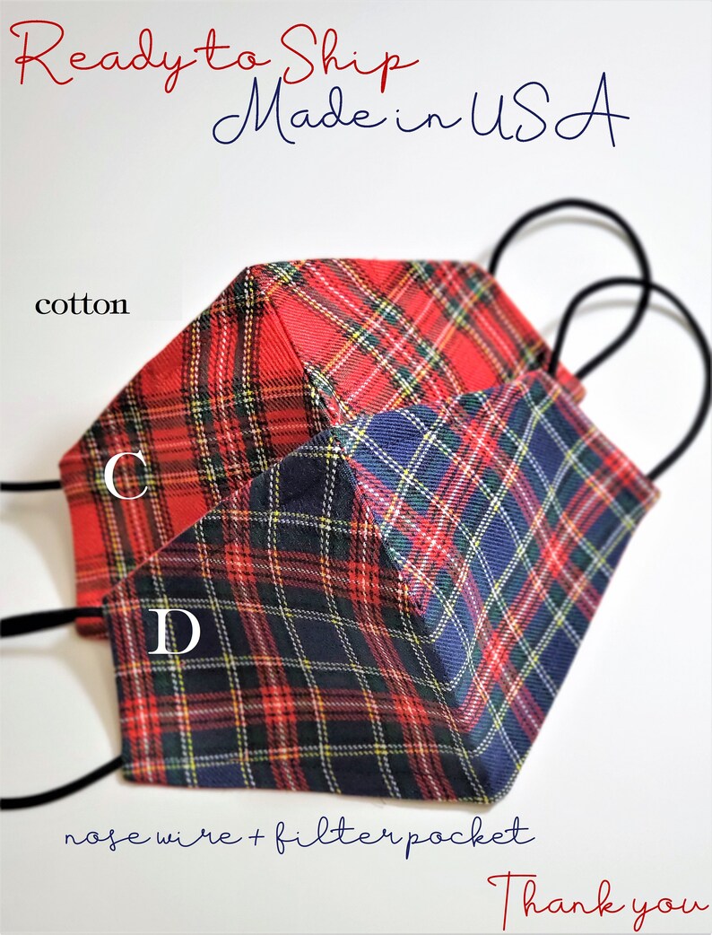 May include: Two red and blue plaid cotton face masks with nose wire and filter pocket. The masks are ready to ship and made in the USA. The text "C" and "D" are visible on the masks.