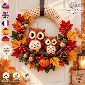 May include: A crochet wreath featuring two brown owls with large black eyes, perched on a branch. The wreath is decorated with crocheted autumn leaves in red, orange, and green, along with small pumpkins, acorns, and pinecones. Text reads GoldenHookPattern.