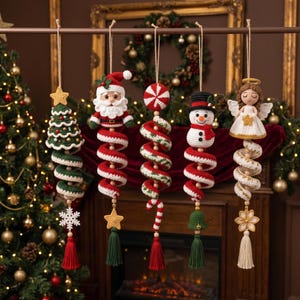 May include: Five hanging crochet ornaments featuring a Christmas tree, Santa Claus, a peppermint swirl, a snowman, and an angel. Each figure is attached to a long, spiraling red and white or green and white crochet tail with a tassel at the bottom.