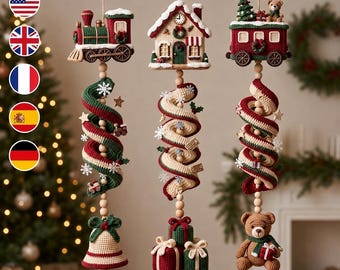May include: Three hanging Christmas ornaments featuring crocheted designs: a train, a house, and a train car. Each ornament includes a spiral tail in red, green, and cream, accented with wooden beads, snowflakes, a bell, gift boxes, and a teddy bear.
