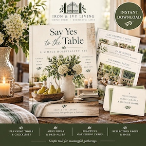 May include: A hospitality kit titled Say Yes to the Table by Iron & Ivy Living, featuring a book with a cover image of pears in a bowl and white flowers in a pitcher, alongside printed gathering cards, easy menus, and planning pages.