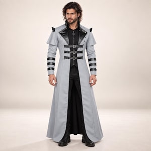 May include: A light gray long coat featuring black faux leather lapels, three horizontal buckled straps across the chest, and black faux leather bands on the sleeves. The coat has a high collar, shoulder accents, and a full-length skirt design.