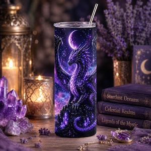 May include: A cylindrical tumbler featuring a vibrant purple dragon perched on a rocky surface against a starry night sky with a crescent moon. The design includes a clear lid and a metallic straw. The artwork displays deep violet and blue hues.