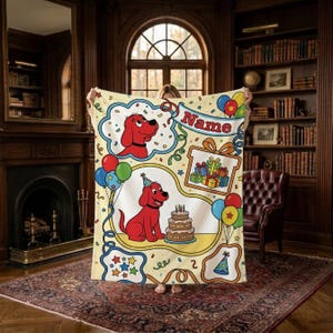May include: A cream-colored throw blanket featuring a red dog character, a birthday cake, colorful balloons, and gift boxes. The blanket includes a banner with the text Name, confetti patterns, and party hat illustrations in a cartoon style.