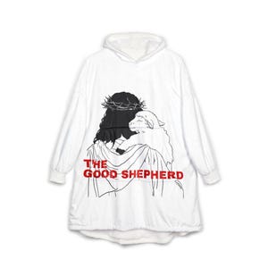 May include: A white hooded sweatshirt featuring a black line art graphic of a figure wearing a crown of thorns and holding a lamb. The text THE GOOD SHEPHERD is printed in bold red capital letters across the lower portion of the graphic design.