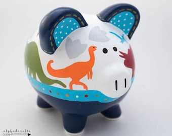 Hucha personalizada de dinosaurio jurásico en azul marino, naranja, verde y rojo