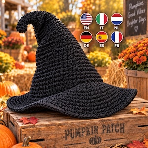 May include: A black crocheted witch hat with a pointed, slightly curved top and a wide, circular brim. The hat features a dense, textured yarn construction with a consistent stitch pattern throughout, creating a structured yet flexible form.
