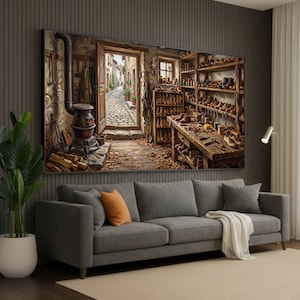 May include: A panoramic wall art print depicting a rustic cobbler workshop interior. The scene features a cast iron stove, wooden shelves filled with various leather shoes, a workbench with tools, and an open door revealing a cobblestone street.