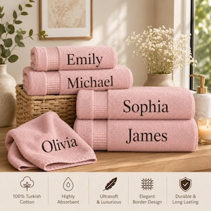 May include: A set of five soft pink cotton towels, each featuring a checkered border and a personalized name embroidered in dark brown thread. The names displayed on the towels are Emily, Michael, Sophia, James, and Olivia, stacked neatly.