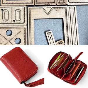 May include: A red leather accordion-style wallet with a zip closure and a wrist strap, featuring the brand name TopHome embossed on the front. The wallet contains multiple interior card slots. Also shown are wooden cutting dies labelled TopHome.