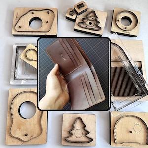 May include: A brown leather bifold wallet with multiple card slots and a central bill compartment, surrounded by various wooden and metal die-cutting tools for leather crafting, including shapes like a Christmas tree and circular patterns.