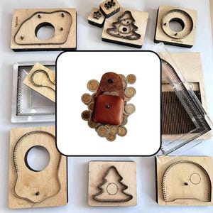 May include: A brown leather coin pouch with a snap closure sits atop a pile of various metallic coins. Surrounding this central image are several wooden cutting dies of different shapes, including tree and circular outlines with metal blades.