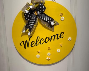 Cartel de bienvenida con abejas