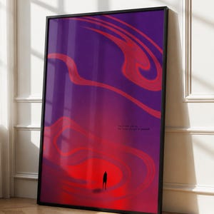 May include: A framed vertical poster featuring a dark purple and red abstract background with swirling lines. A small black silhouette of a person stands at the bottom center. The text reads: The further you go, the closer you get to yourself.