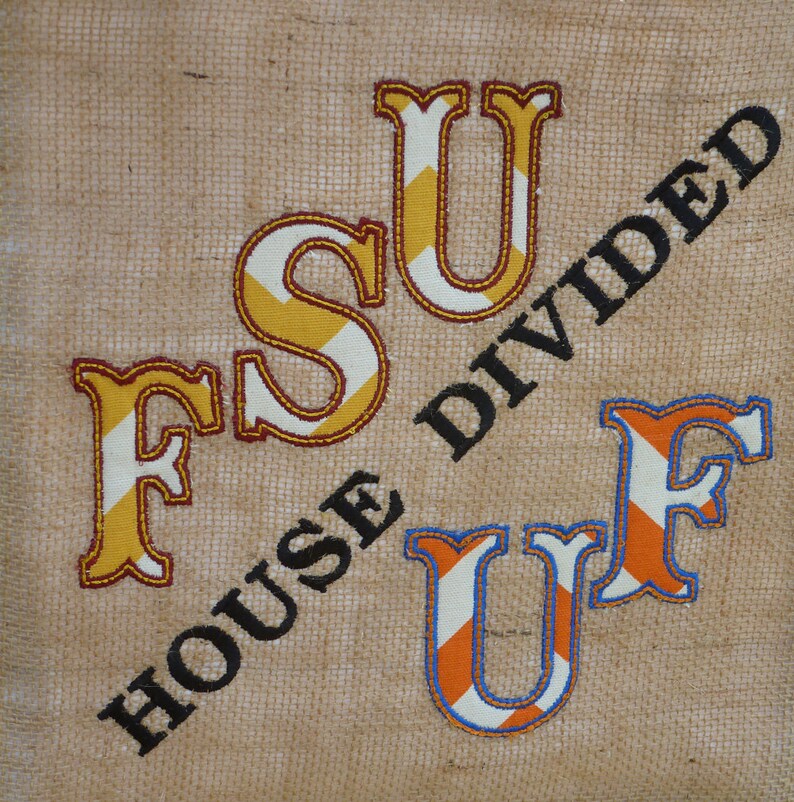May include: A burlap fabric bag with the text "House Divided" in black letters. The letters "FSU" are embroidered in yellow and orange stripes. The letters "UF" are embroidered in orange and blue stripes.