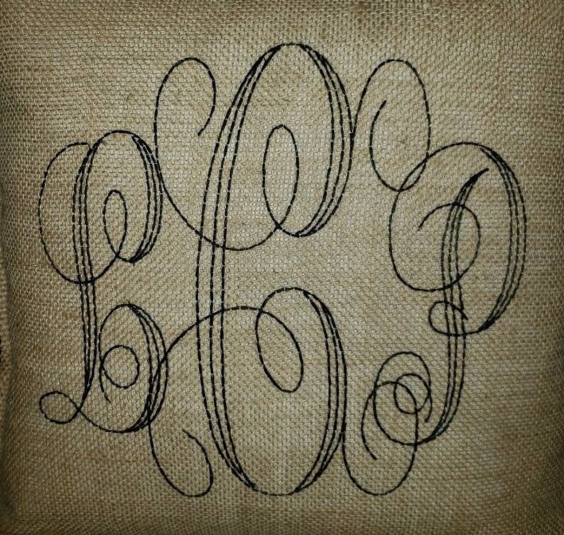 May include: A burlap pillow with a black embroidered monogram of the letters "LHP".