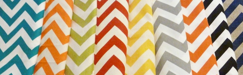May include: A collection of fabric swatches with a chevron pattern in various colors, including teal, orange, yellow, red, gray, and black.
